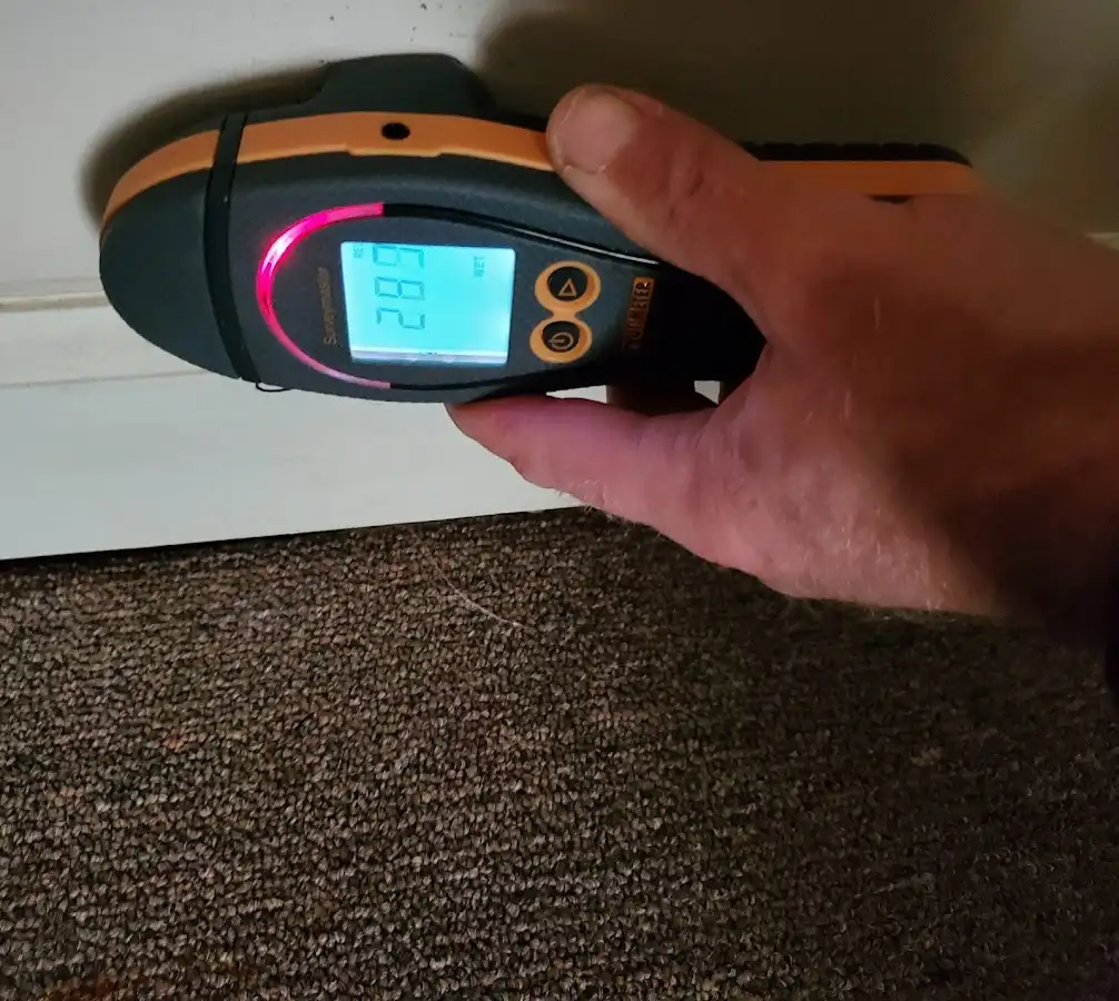 Moisture detection at baseboard during Storm Damage Restoration in Winter Park